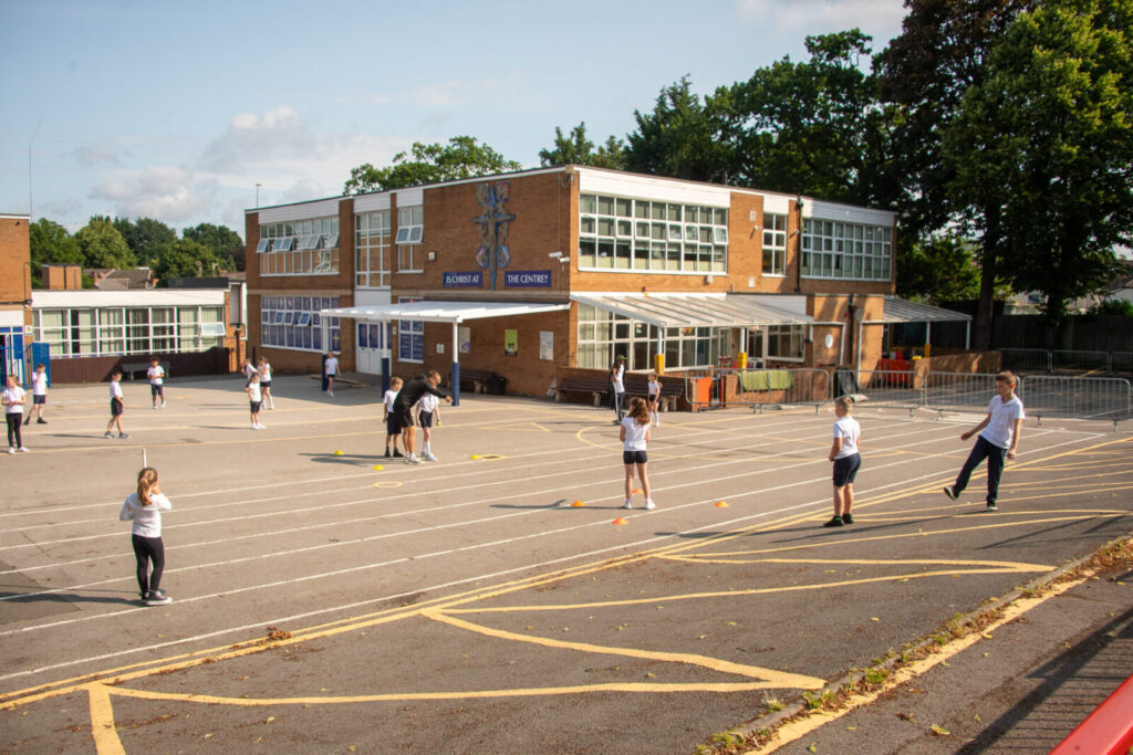 a picture of students playing on the playground