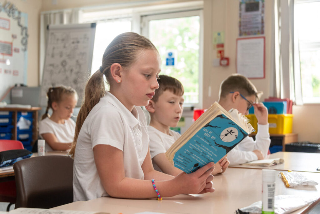 a close up of a student reading